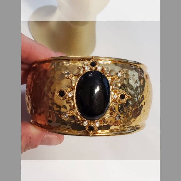 Large heavy gold and black hinged Monet bracelet